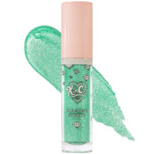 <p>Looking to add some shimmer and sparkle to your makeup routine? Our Standing Ovation shimmer cream shadow is the perfect choice! This iridescent Seafoam Green pigment is infused with silver shimmer, making it perfect for adding some mermaid-like glamour to your look. The doe-foot applicator makes it easy to apply, and you can blend it with your finger or a brush for your desired effect. You can wear it alone or over another shadow for a dazzling finish. And with a net weight of 6.0g, youll have plenty to use.</p>
<p>Want to get even more creative? The Diamond Sharts can be used as a highlighter, a shadow topper, on your collarbones, or all over. Have fun and add some sparkle to your life!</p>
<p>Kim Chi Says:<br />
“I dont have any time for boring and dull shadows and neither should you! Sparkle up your daily makeup routine with this dazzling array of glitter shadows!”</p>
<p>Application Tips</p>
<p>Apply with the doe-foot applicator<br />
Blend with your finger or a brush for your desired look<br />
Wear alone or over another shadow</p>
